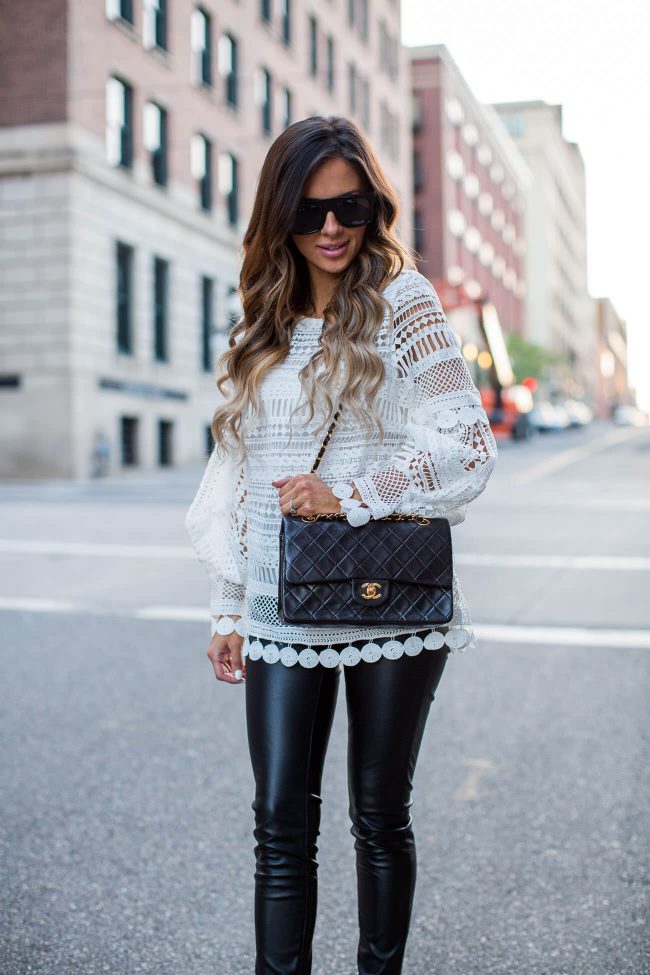 fashion blogger mia mia mine wearing a lace top from shopbop and a chanel bag