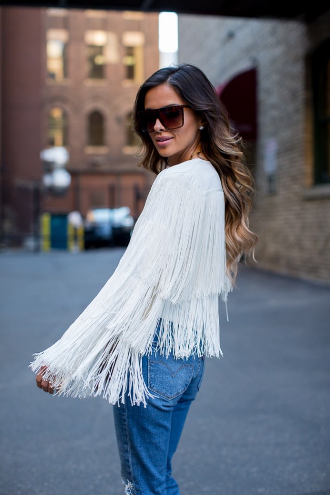 Maria Vizuete in a fringe jacket and sunglasses by nasty gal