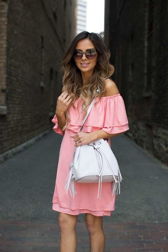 mia mia mine wearing a pink off-the-shoulder dress from nordstrom's may essentials