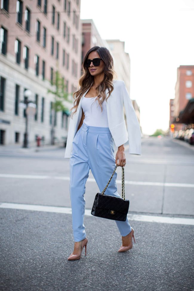 fashion blogger mia mia mine in blue pants from asos and a chanel bag