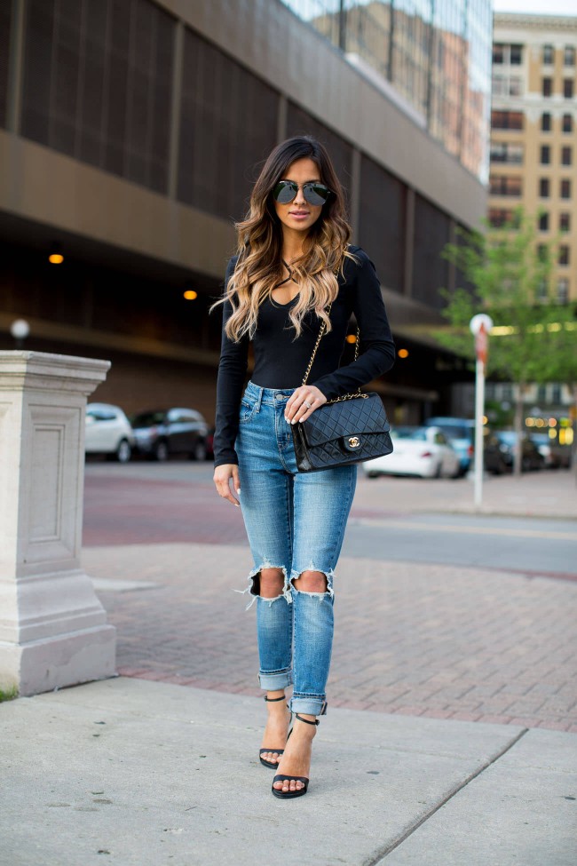 fashion blogger maria vizuete wearing a black bodysuit and levis jeans from shopbop.com