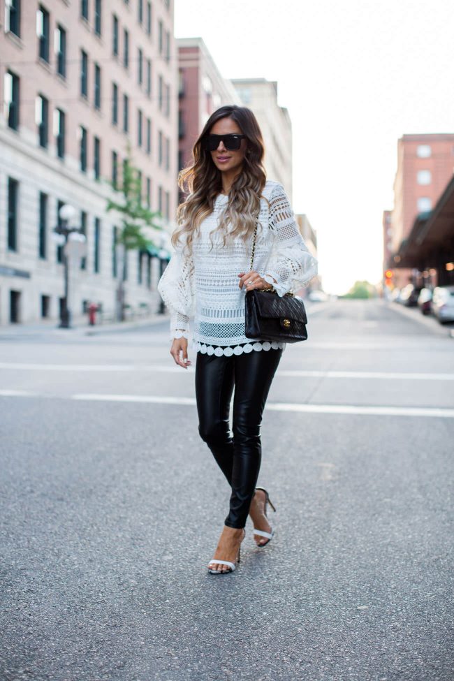 fashion blogger mia mia mine in a white lace top and leather pants from shopbop