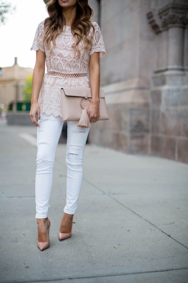 mia mia mine carrying a pink lace tassel bag from asos