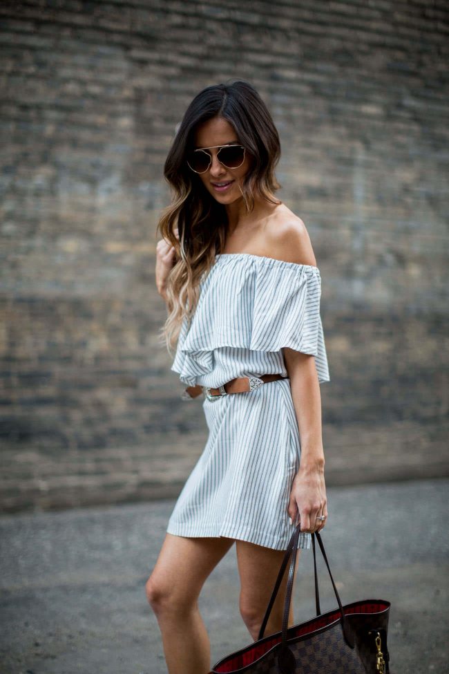 fashion blogger mia mia mine wearing a striped dress from nordstrom and a double-buckle belt from asos