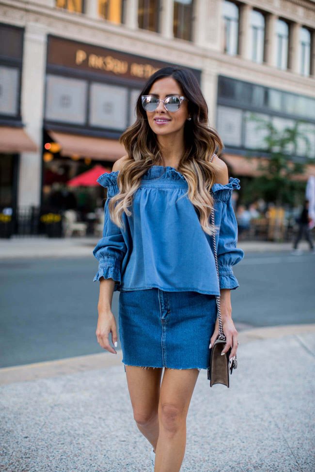 fashion blogger maria vizuete wearing a chambray off-the-shoulder top from asos and a denim skirt from topshop