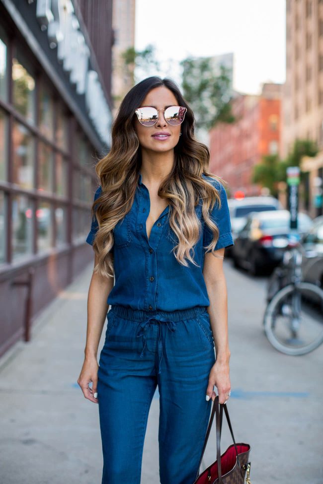 fashion blogger mia mia mine in a denim jumpsuit and rose gold mirrored sunglasses 