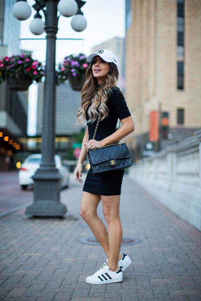 fashion blogger mia mia mine in a summer outfit wearing adidas superstar sneakers and a chanel bag