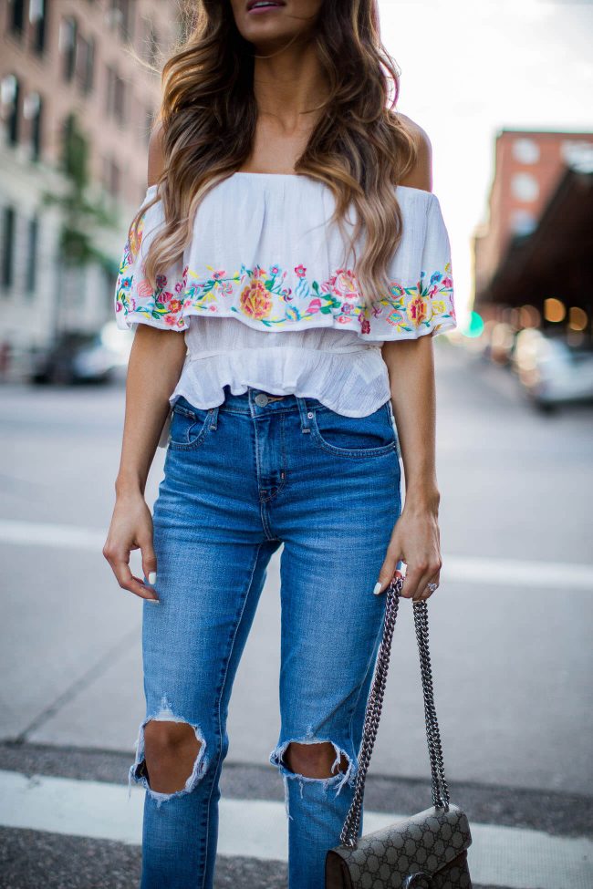 fashion blogger mia mia mine in an off-the-shoulder top from shopbop