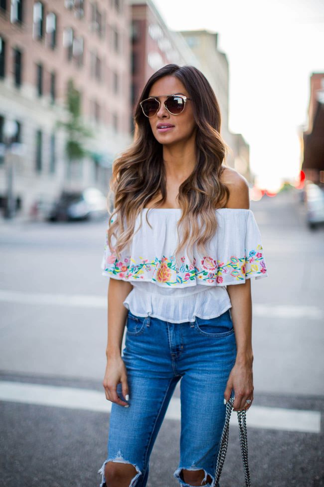 fashion blogger mia mia mine in an embroidered top for summer