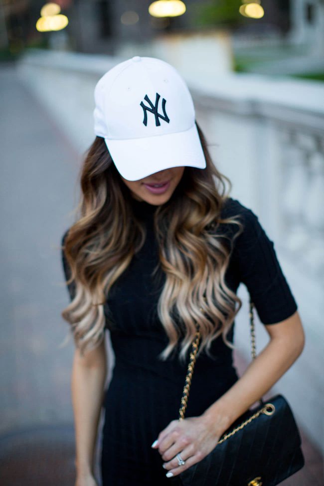 fashion blogger mia mia mine in a yankees hat and chanel bag