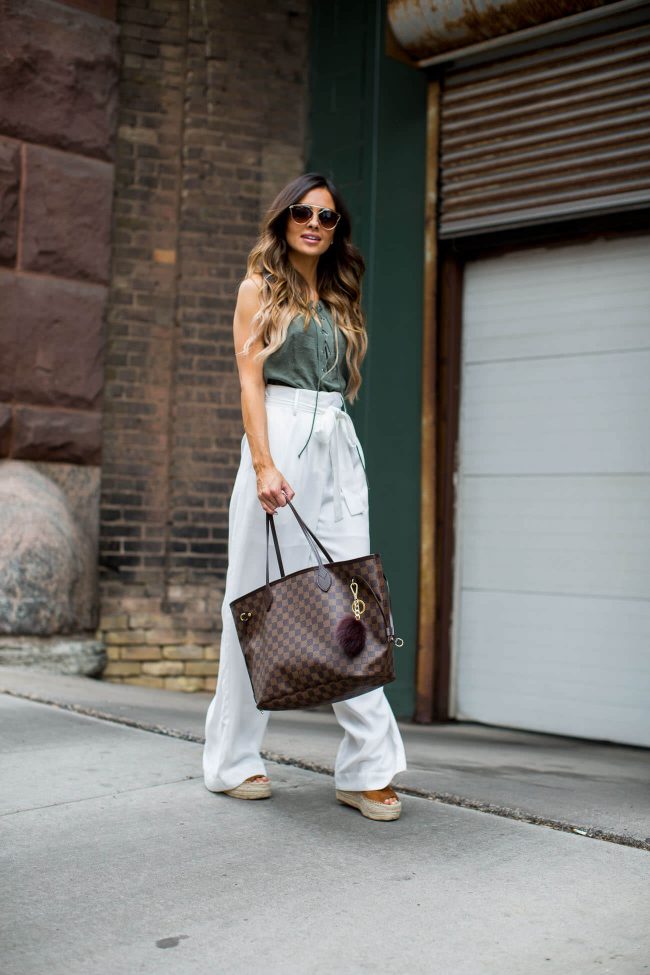 fashion blogger mia mia mine in white trousers from nordstrom and an olive tank top