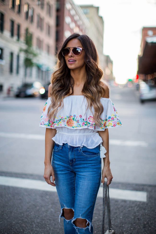 fashion blogger mia mia mine in an embroidered off-the-shoulder top from shopbop and free people sunglasses