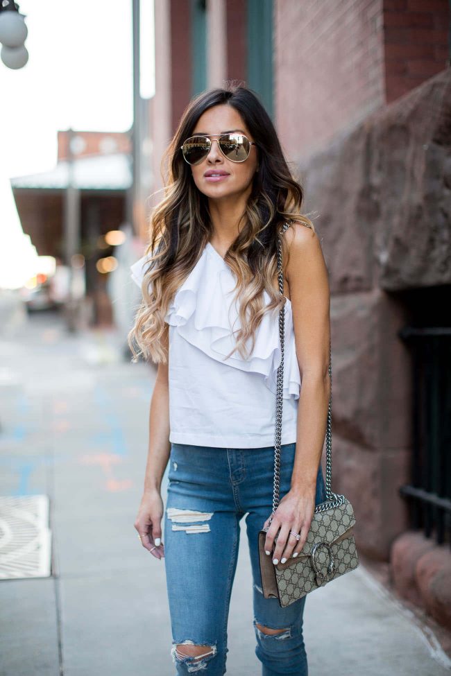 fashion blogger mia mia mine in a white ruffled top and skinny jeans from topshop