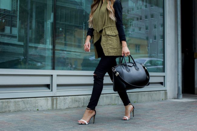 fashion blogger mia mia mine wearing an olive utility vest and topshop jeans