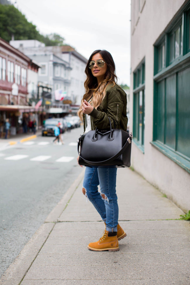 fashion blogger mia mia mine in a topshop bomber jacket and levis jeans