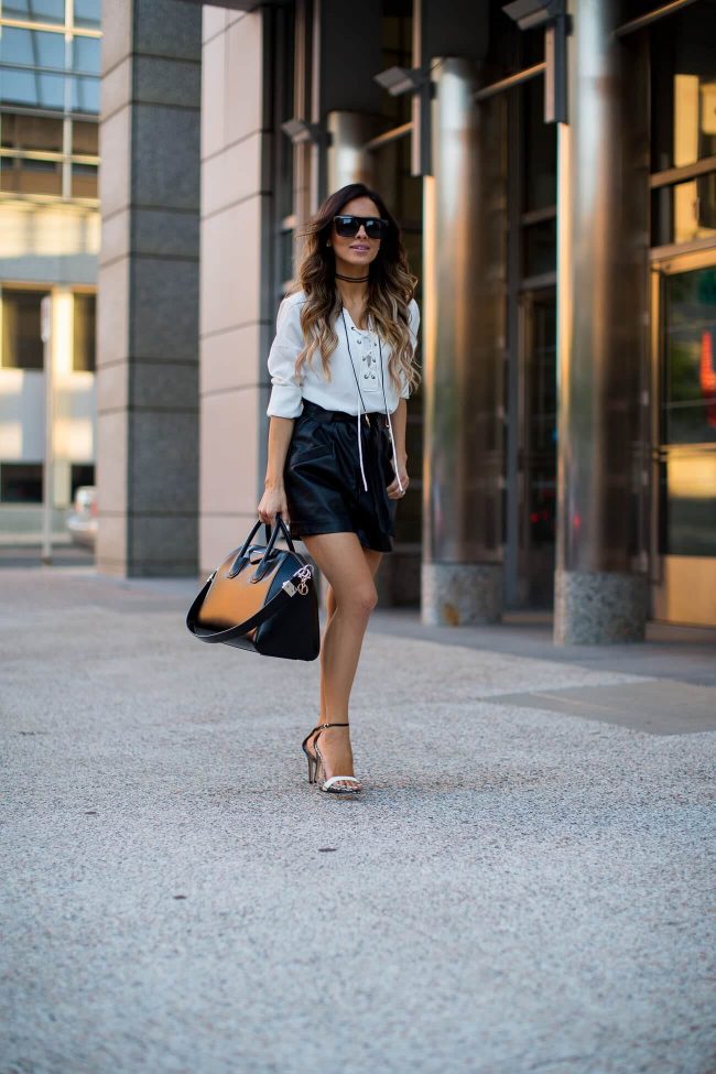 fashion blogger mia mia mine wearing a sanctuary lace-up top and leather shorts