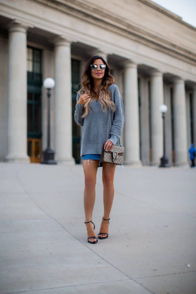 fashion blogger mia mia mine wearing an oversized v-neck sweater from nordstrom