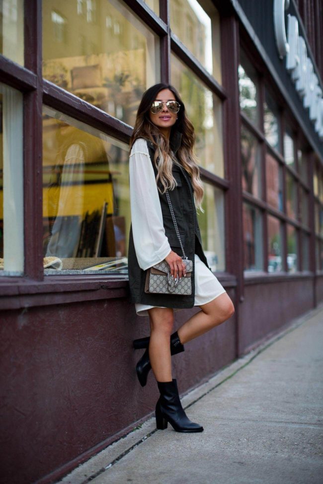 fashion blogger mia mia mine in a white shift dress and utility vest from nordstrom rack 