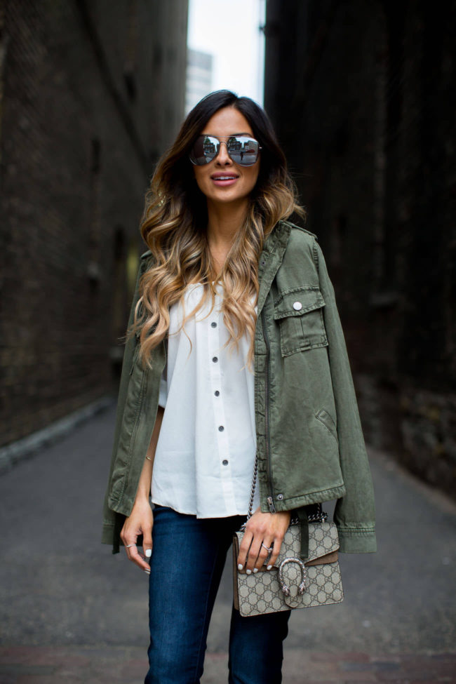 mia mia mine wearing a utility jacket and off-the-shoulder top from new york & company