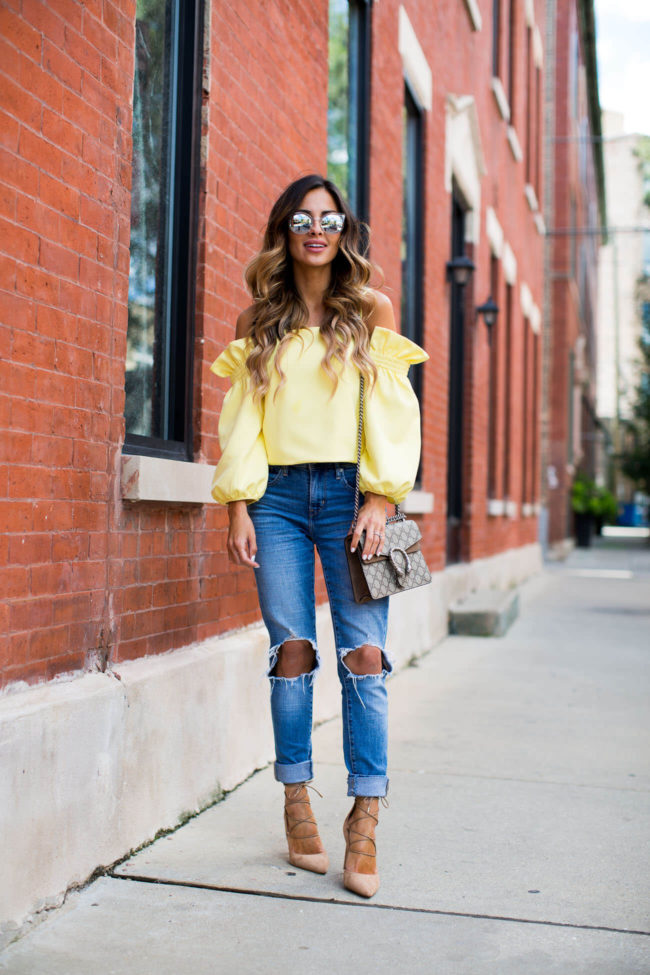 fashion blogger mia mia mine in a yellow off-the-shoulder top from shopbop