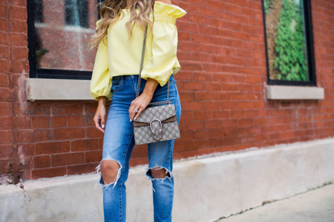 minnesota fashion blogger mia mia mine in a yellow top from shopbop and levis jeans