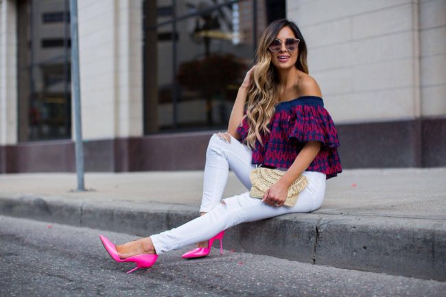 fashion blogger mia mia mine in a fuchsia top and white jeans 