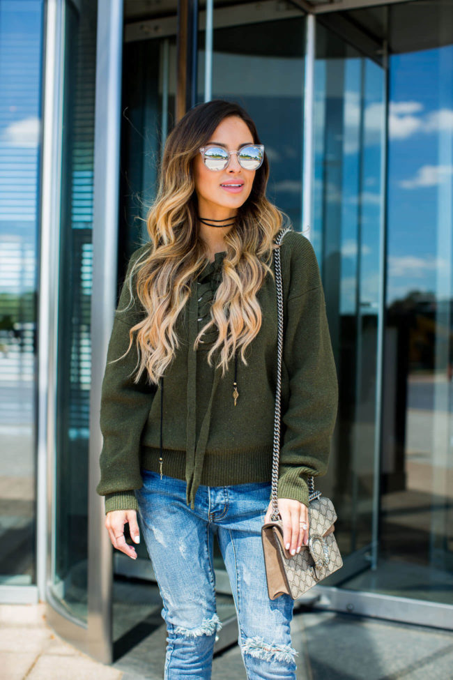 fashion blogger mia mia mine in a bolo and lace-up sweater from shopbop