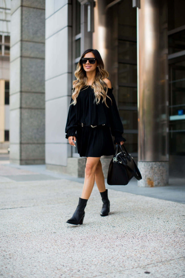 fashion blogger mia mia mine wearing a black summer dress by norma kamali and black booties by steve madden 