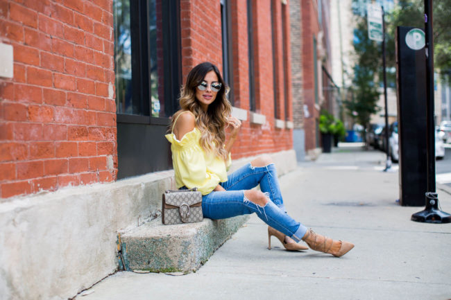fashion blogger mia mia mine in chicago wearing a yellow top from shopbop