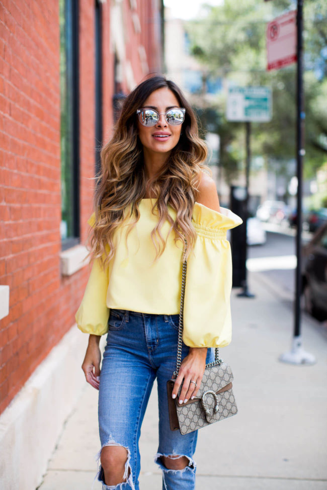 fashion blogger mia mia mine in a yellow off-the-shoulder top from shopbop