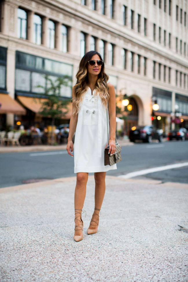midwest fashion blogger mia mia mine in a white lace-up dress and lace-up heels by sam edelman
