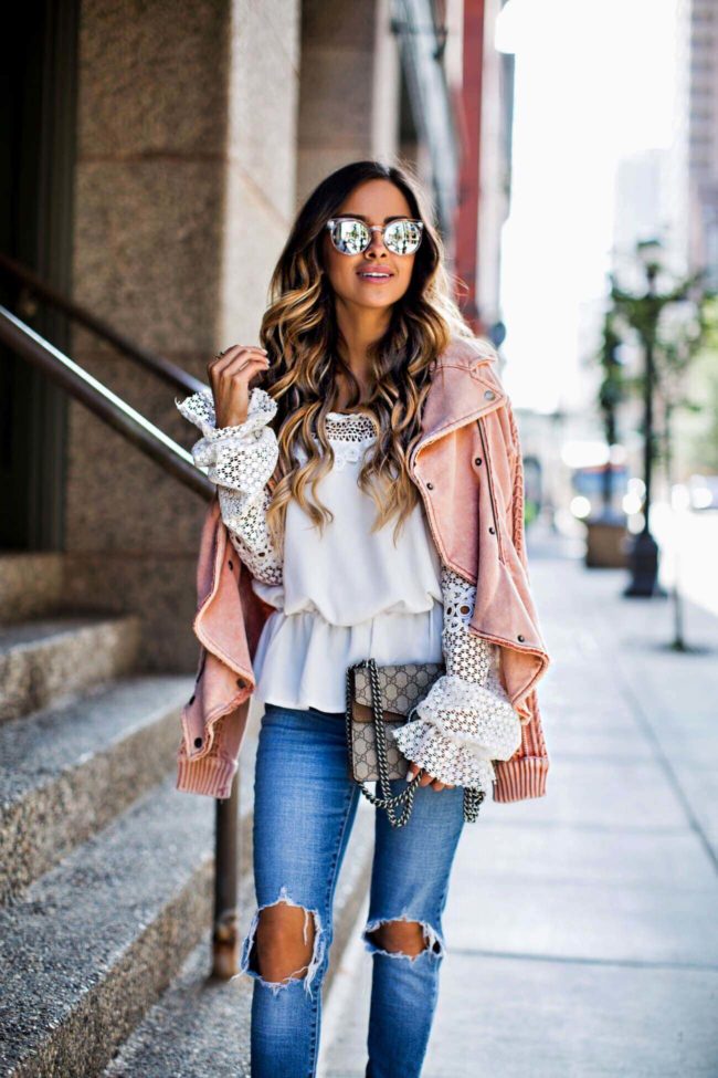 fashion blogger mia mia mine in a lace top from shopbop and levis jeans