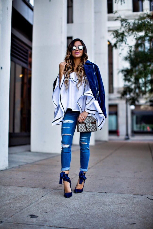 fashion blogger mia mia mine wearing a ruffle off-the-shoulder top by style mafia and topshop ripped jeans