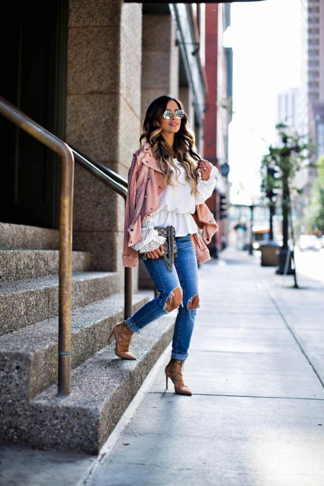 fashion blogger mia mia mine wearing a white lace top and levis jeans from shopbop