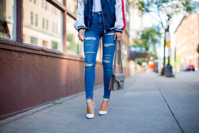 fashion blogger mia mia mine wearing ripped jeans by topshop and white heels