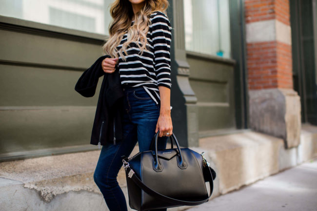 fashion blogger mia mia mine in a black moto jacket and striped top from old navy