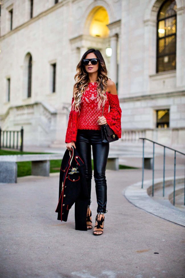 mia mia mine in a red bell sleeve top from revolve and chelsea paris tassel heels
