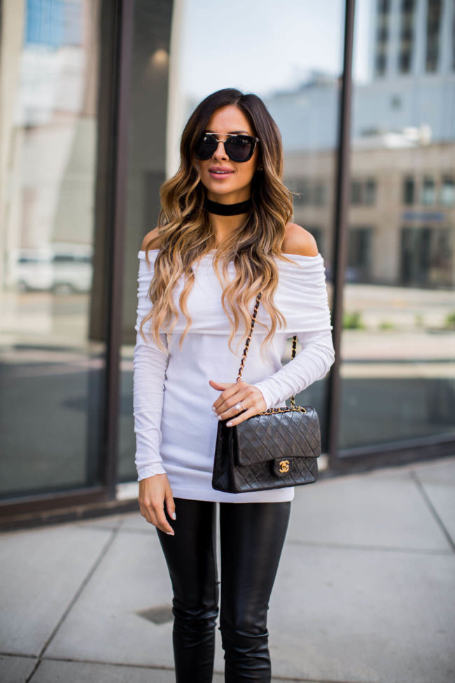 mia mia mine in a white off-the-shoulder top and black leather pants from shopbop