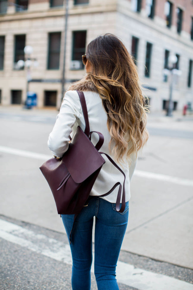 mia mia mine carrying a burgundy backpack from sole society