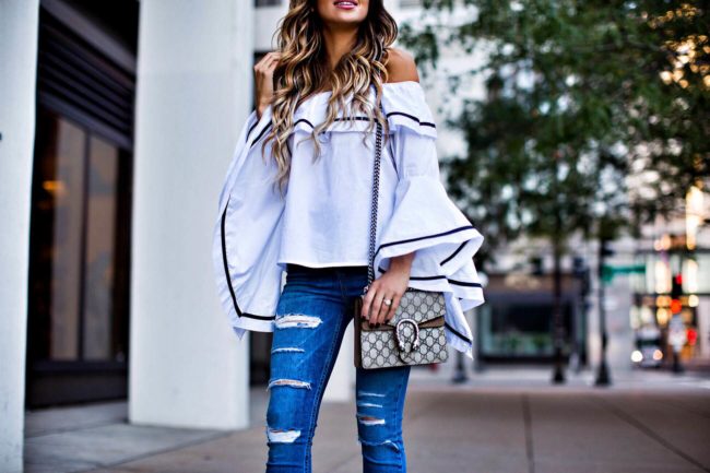 mn fashion blogger mia mia mine wearing a bell sleeve top and ripped jeans from nordstrom