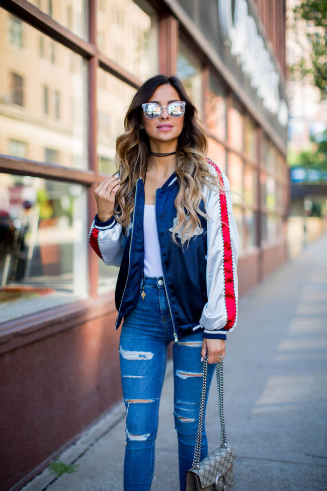 fashion blogger mia mia mine in a storets jacket and ripped jeans from topshop