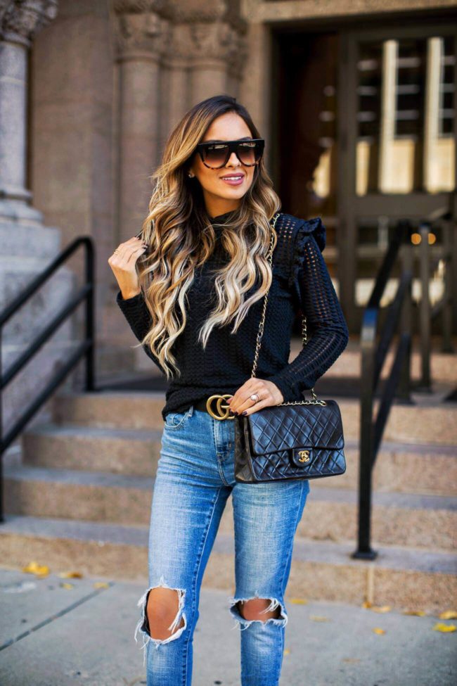 fashion blogger mia mia mine wearing a black turtleneck sweater from nordstrom