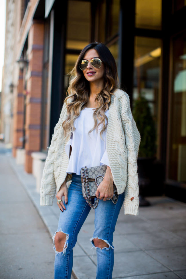 fashion blogger mia mia mine wearing a handknit sweater from chicwish and ripped jeans