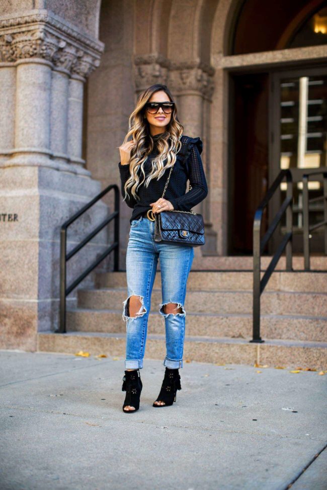 fashion blogger mia mia mine wearing a black turtleneck sweater from nordstrom and ivank trump black booties
