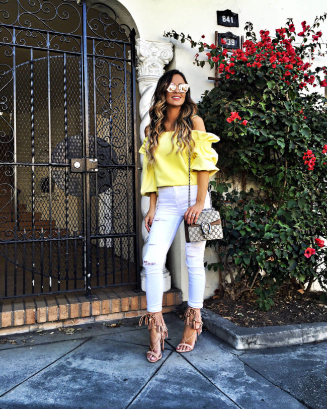 mia mia mine wearing a yellow top from the shopbop event of the season october 2016