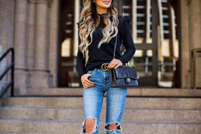 fashion blogger mia mia mine wearing a black turtleneck sweater from nordstrom and a gucci double g belt