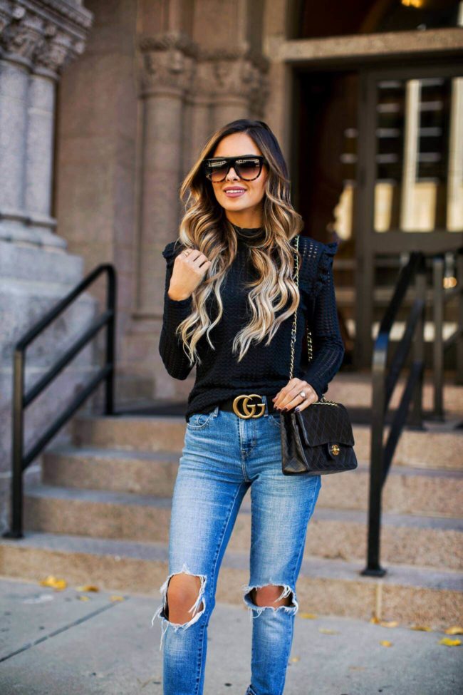 fashion blogger mia mia mine wearing a black turtleneck sweater from nordstrom and celine sunglasses