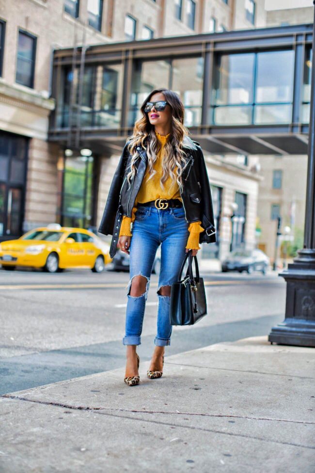 fashion blogger mia mia mine wearing a yellow top from shopbop and levis jeans