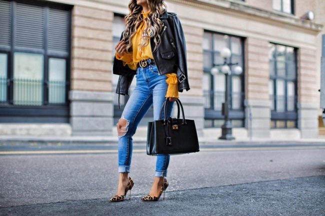 fashion blogger mia mia mine wearing leopard heels and levi's jeans in minnesota