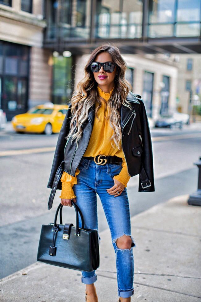 fashion blogger mia mia mine in a gucci double g buckle belt and levi's jeans